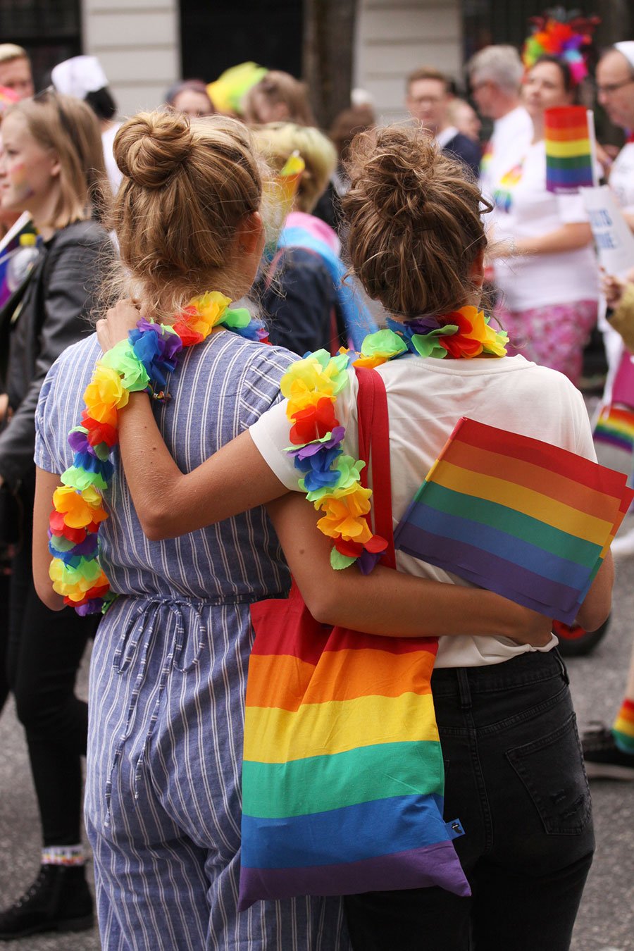 female pride hugging