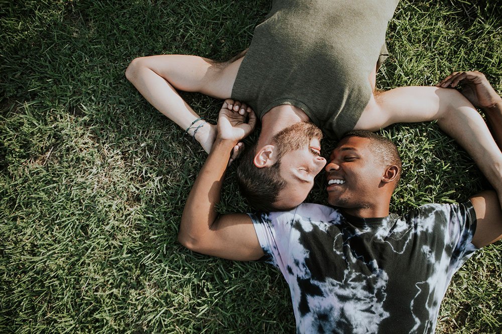 Men laying in field