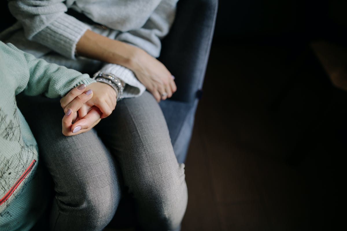 parent holding child's hand