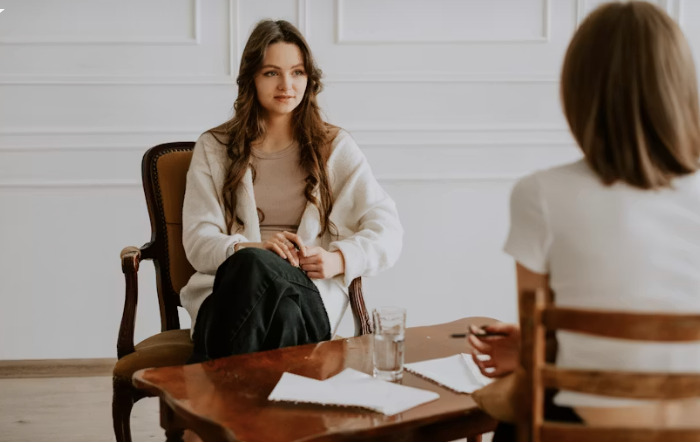 Therapist explaining whether ketamine-assisted therapy is legal to an LGBTQIA+ client in Denver
