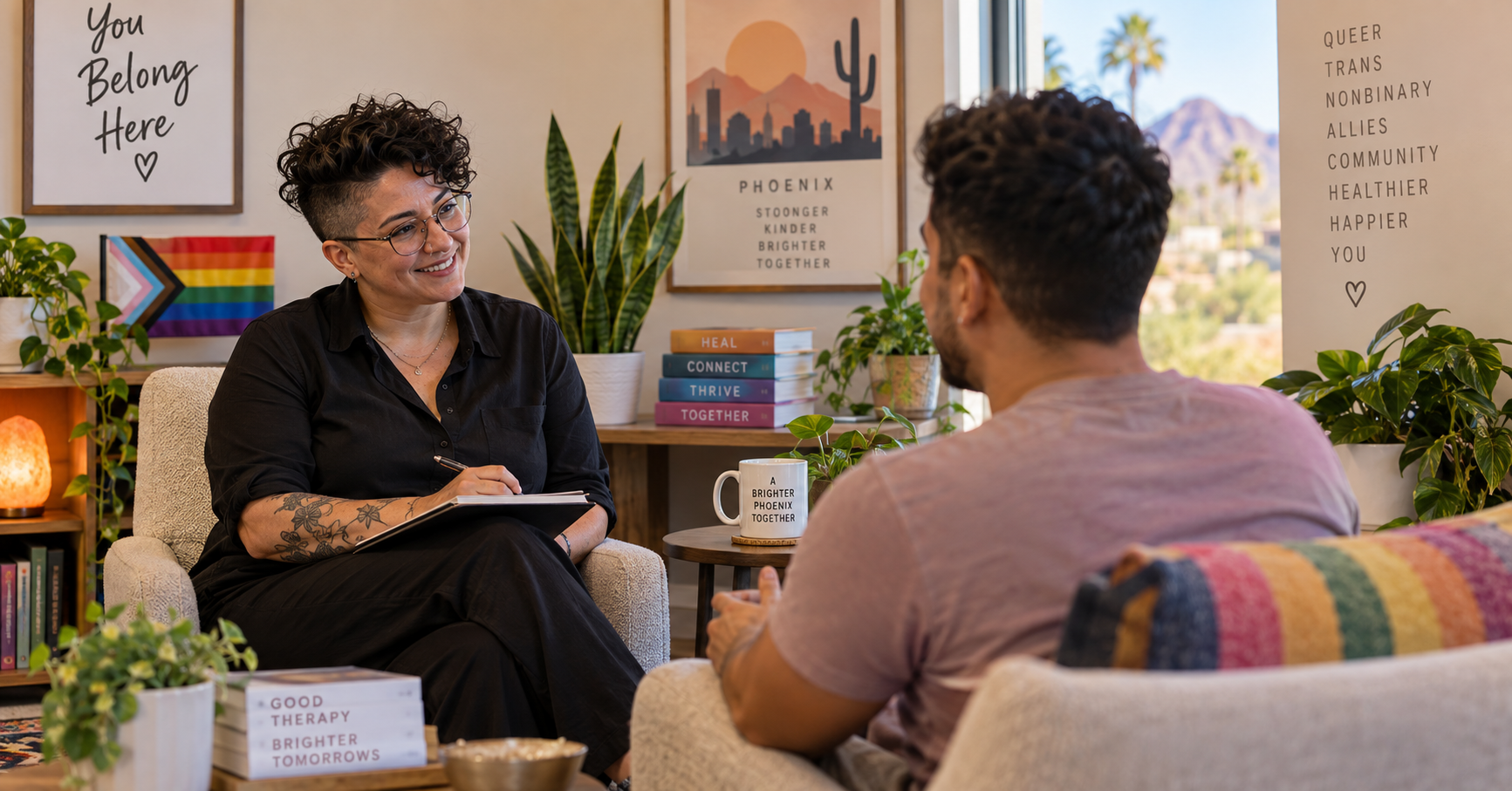 LGBTQIA+ affirming therapist in Phoenix talking with a client in a bright, welcoming office